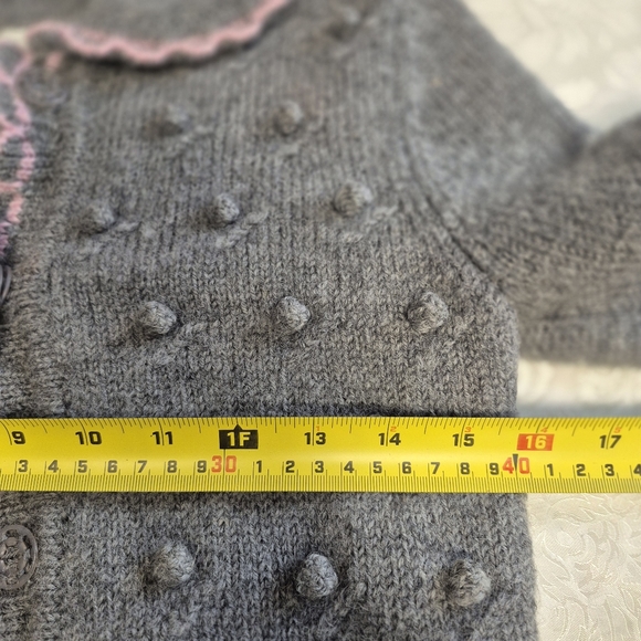 Gray knit  popcorn-stitch baby cardigan with a pink scalloped trim.  - Picture 3 of 6